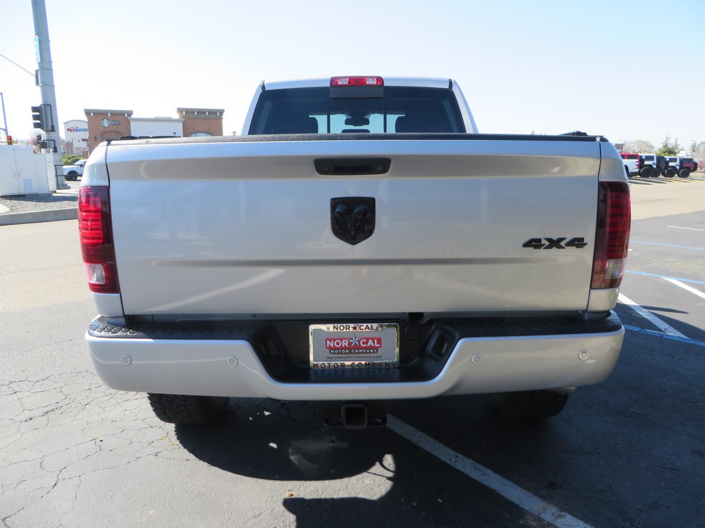 2016 SILVER /BLACK RAM 2500 Laramie Crew Cab SWB 4WD (3C6UR5FL3GG) with an 6.7L L6 OHV 24V TURBO DIESEL engine, 6A transmission, located at 2630 Grass Valley Highway, Auburn, CA, 95603, (530) 508-5100, 38.937893, -121.095482 - Leveled Ram sitting on Fuel Offroad wheels, Falken Wildpeak AT tires, Amp Power steps, Rolling Bed cover, Color matched fender flares, and window tint. - Photo#5